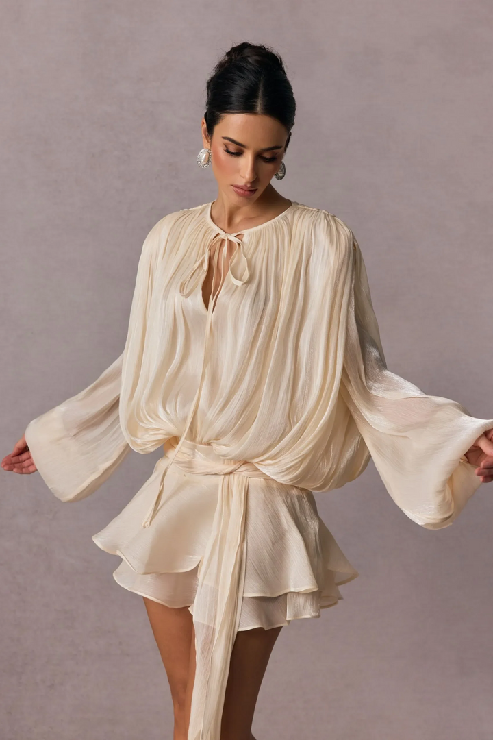 Pleated Long Sleeve Blouse with Tie-Neck Closure and Peplum Hem