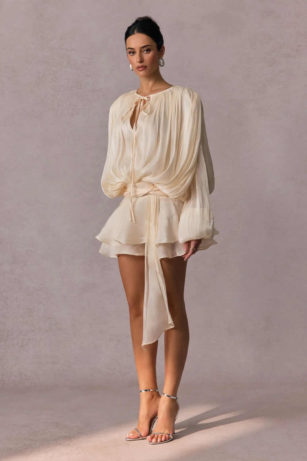 Pleated Long Sleeve Blouse with Tie-Neck Closure and Peplum Hem