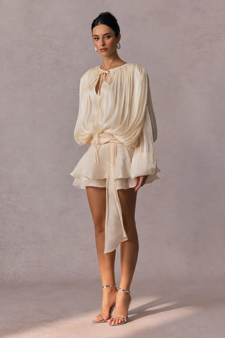 Pleated Long Sleeve Blouse with Tie-Neck Closure and Peplum Hem