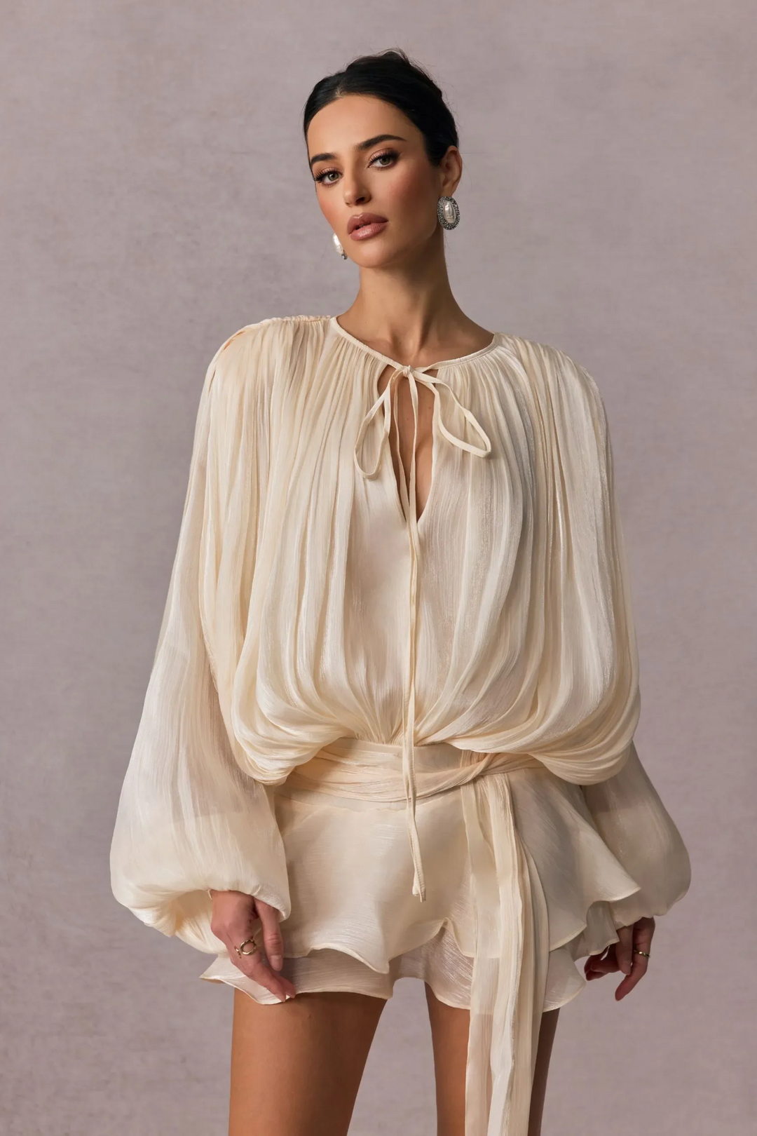 Pleated Long Sleeve Blouse with Tie-Neck Closure and Peplum Hem