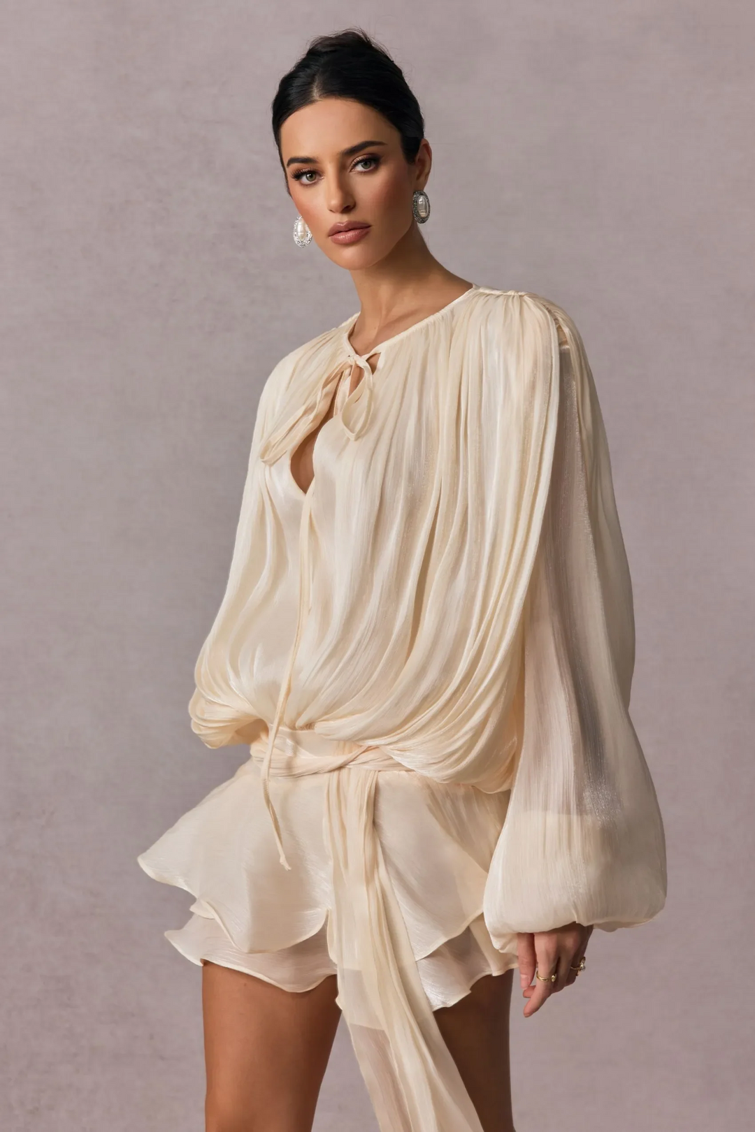 Pleated Long Sleeve Blouse with Tie-Neck Closure and Peplum Hem