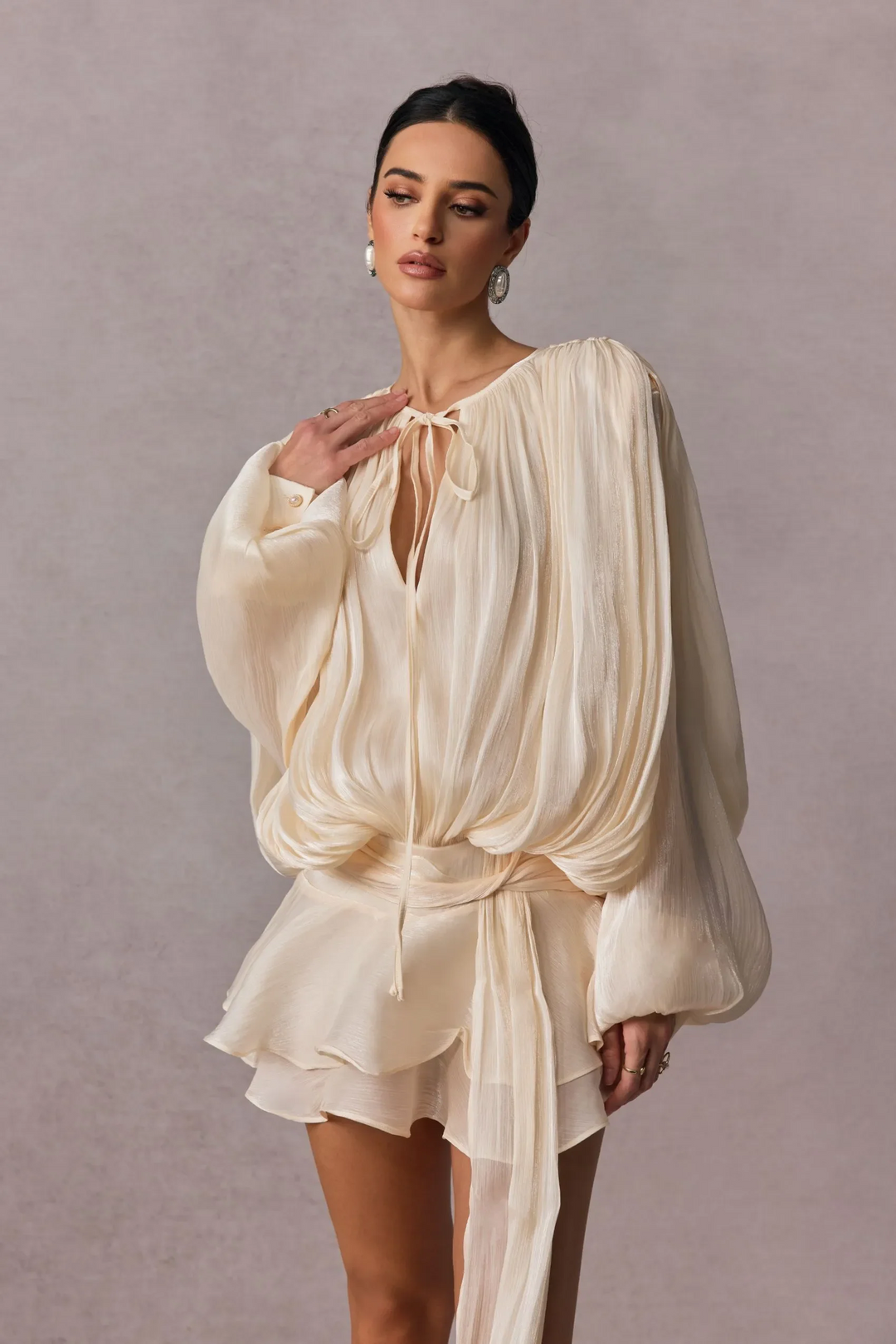 Pleated Long Sleeve Blouse with Tie-Neck Closure and Peplum Hem